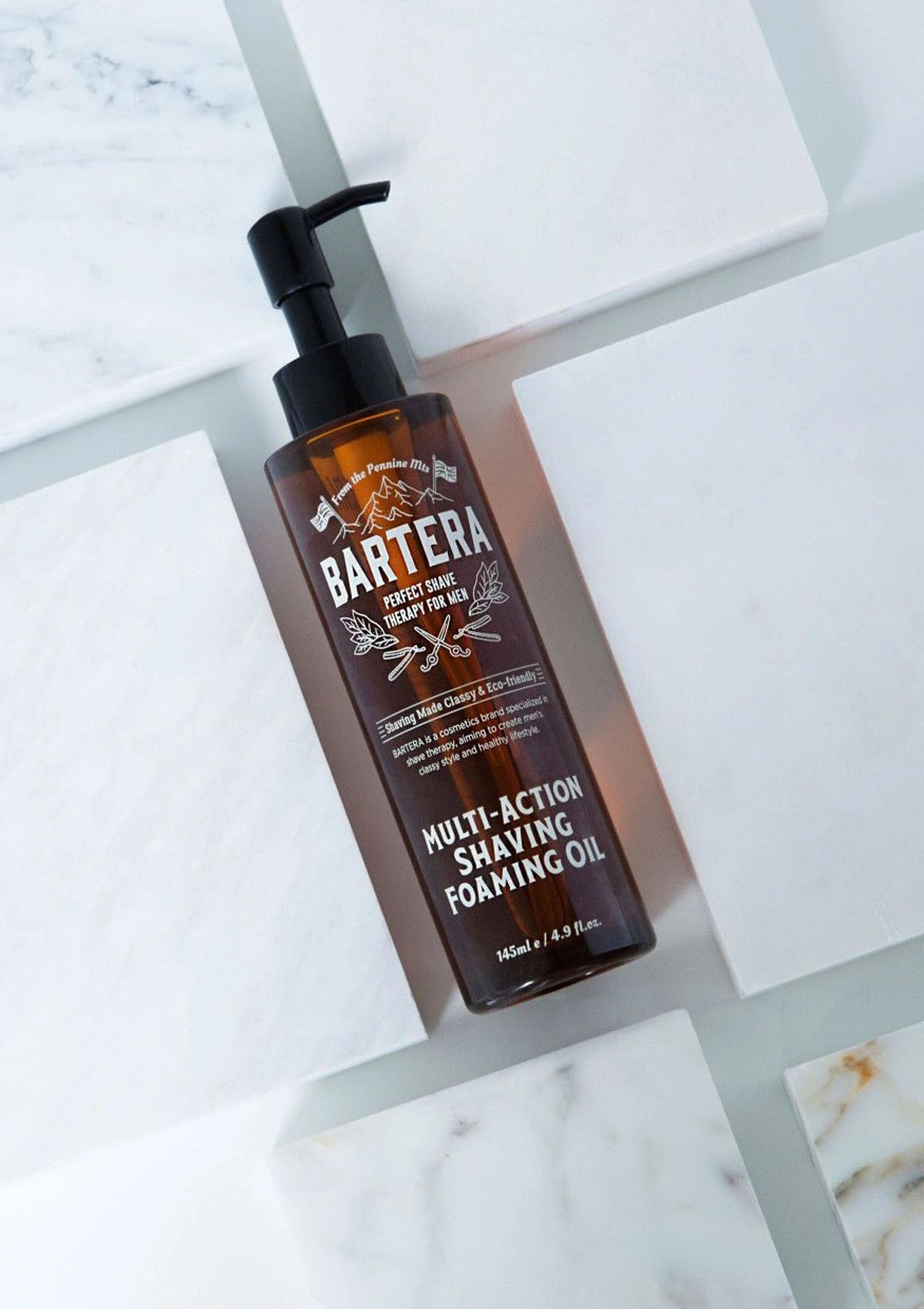 Bartera multi-action shaving foaming oil bottle on a marble surface